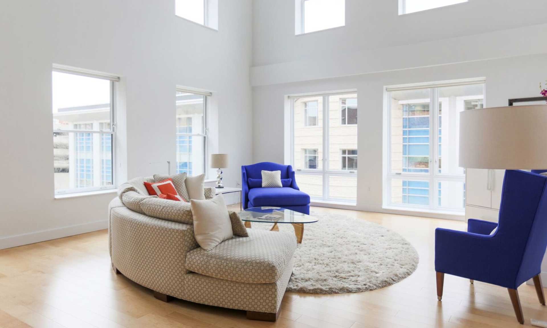 Comfortable living room with natural light through large windows